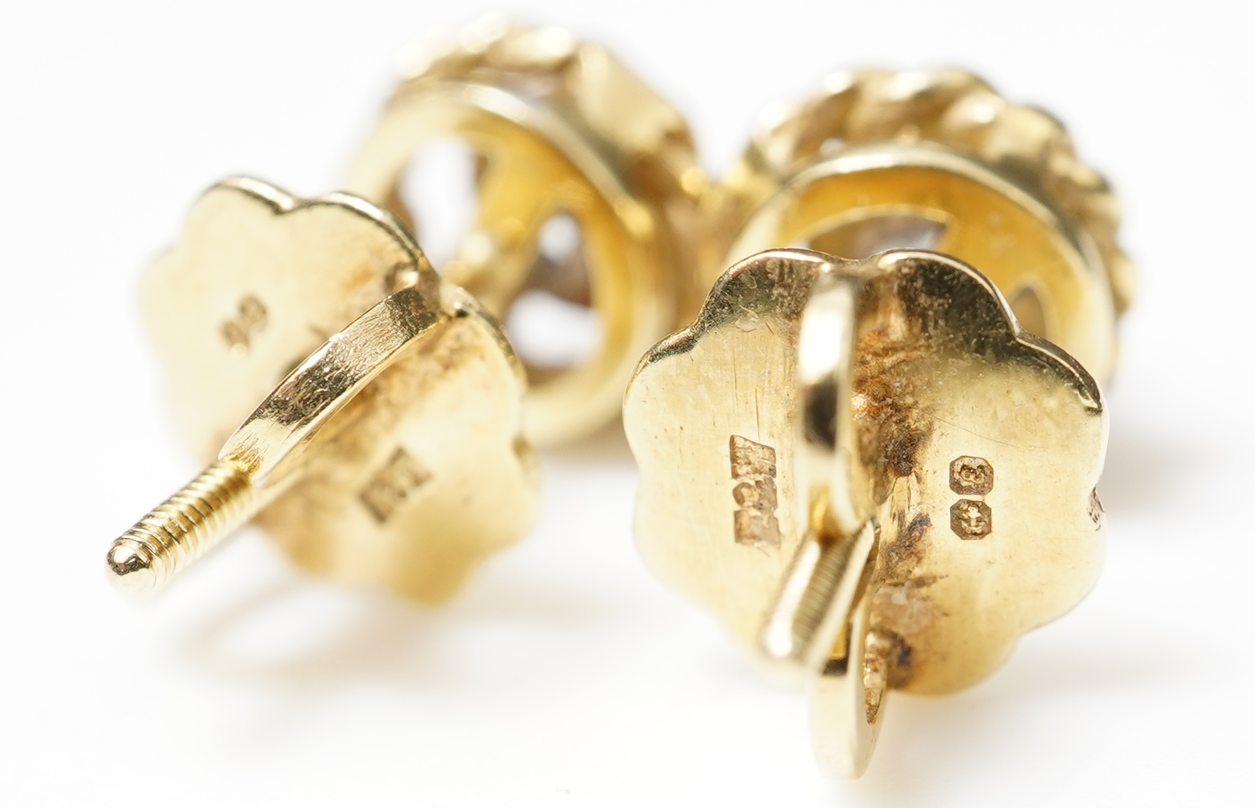 A pair of diamond stud earrings